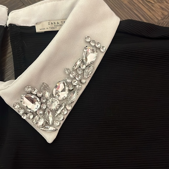 Black dress with white collar that has crystals. - Picture 4 of 6